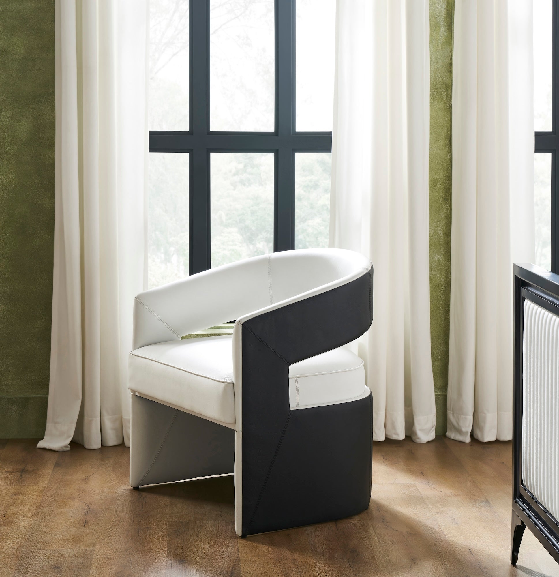 FN-5208-X_1|Modern two-tone armchair with white and black upholstery, featuring a unique curved design for contemporary living spaces.