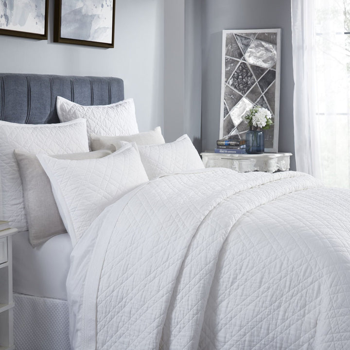CL-253-11096_3|Detailed view of a crisp white quilted coverlet set, adding clean comfort and elegant modern bedroom appeal effortlessly.