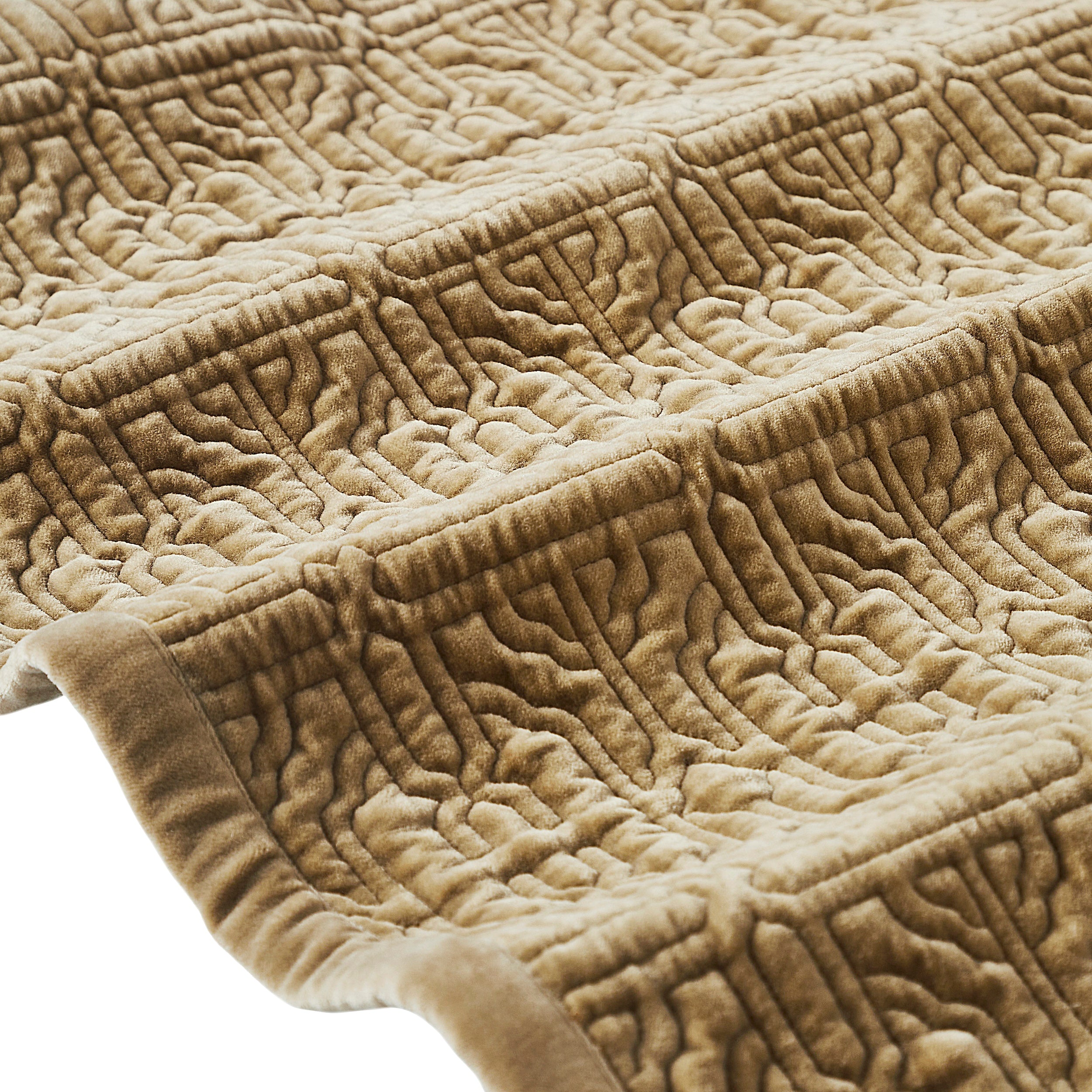 QT-377-11096_7|Detailed close-up of a tan quilted bedspread's corner, highlighting its embossed geometric pattern and soft, luxurious texture.