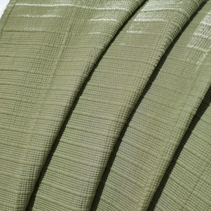 CL-270-9496_8|Close-up of draped sage green textured cotton blend coverlet, showcasing its soft ripple texture and weave.