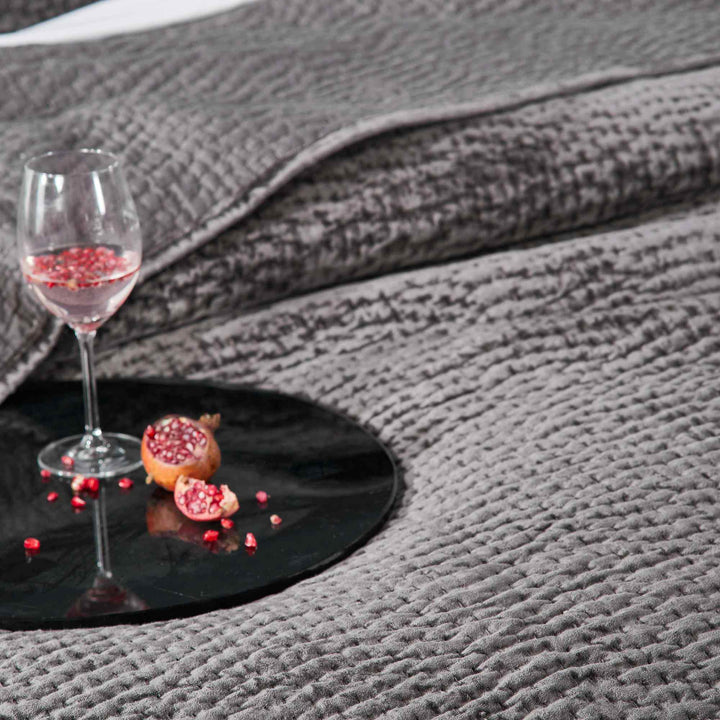 CL-184-9496_4|Intimate close-up of a dark gray textured coverlet, offering a cozy ambiance for relaxation and modern comfort.