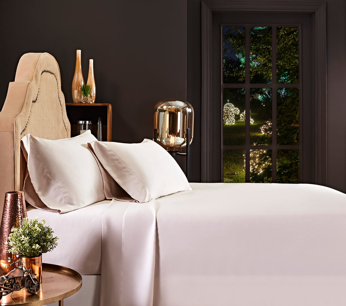 CSS-510-7284_1|Pale beige 100% Lyocell sheet set on a bed. Includes two pillowcases and a flat sheet with a sateen weave.