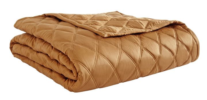 CL-260-11096_6|Folded gold diamond quilted coverlet, showcasing its rich, luxurious texture and sophisticated geometric pattern.