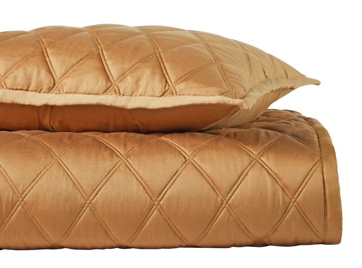 CL-260-9496_8|Golden bronze quilted coverlet and matching pillow with classic diamond pattern, enhancing elegant bedroom decor.
