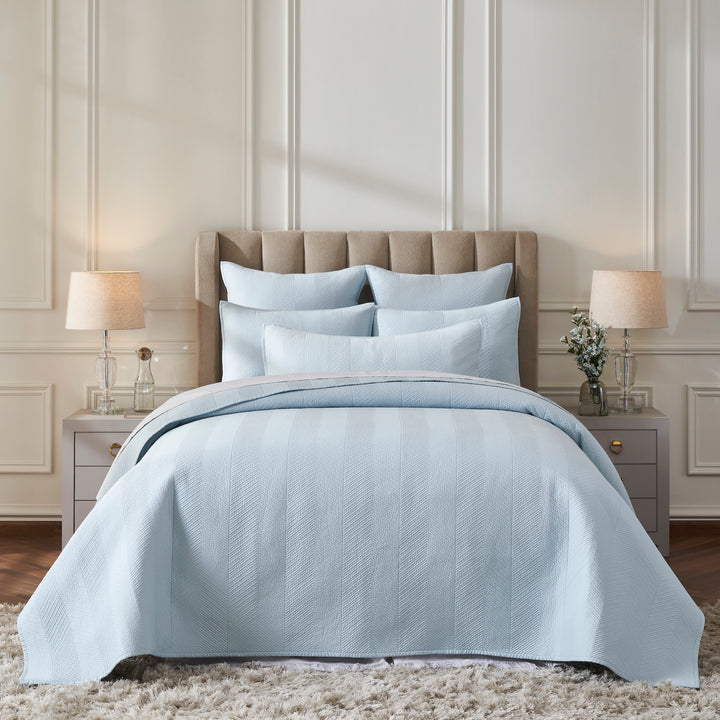 CL-262-9496_1|Elegant light blue quilted coverlet with subtle herringbone pattern on a full bed in a serene bedroom setting.