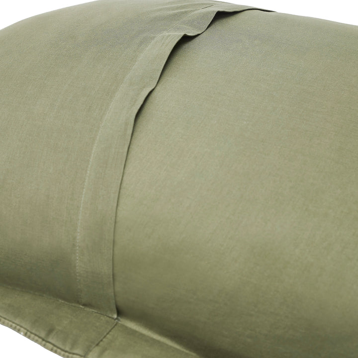 SS-270-2026_2|Close-up of a sage green woven coverlet pillow sham, showcasing the smooth texture and classic envelope closure design.