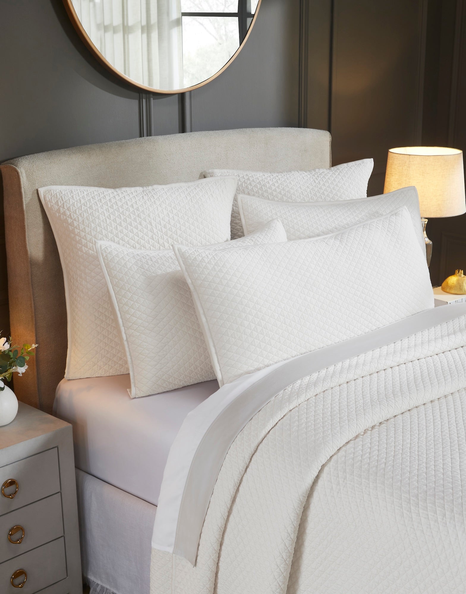 CL-265-11096_3|Close-up of a cream quilted coverlet on a bed, revealing the intricate diamond pattern and soft texture for luxurious bedding.
