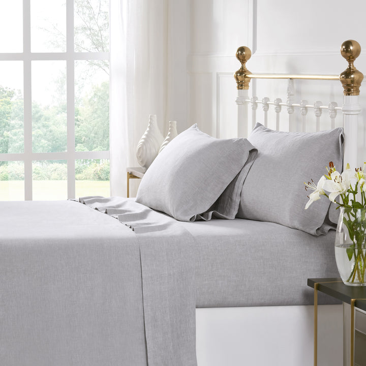 KSS-516-7880_1|Crisp light grey 100% pure linen sheet set on a bed, including fitted sheet, flat sheet, and pillowcases. Luxurious & breathable.