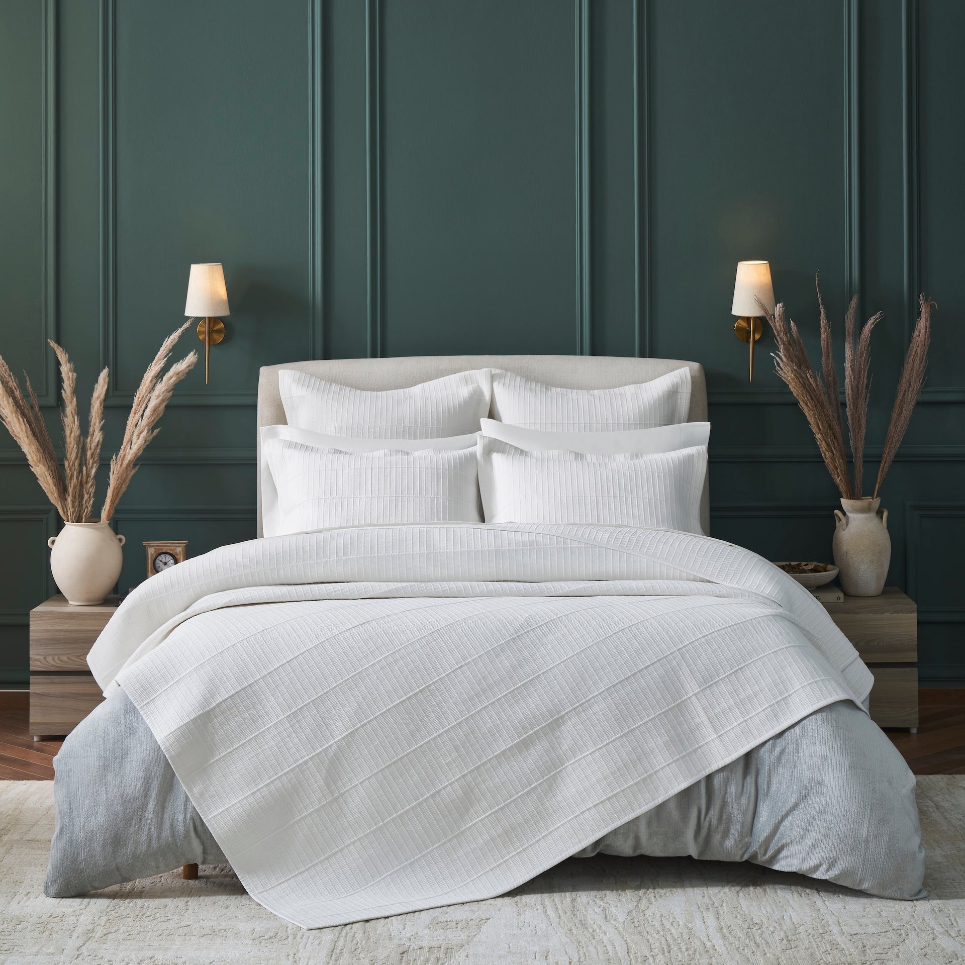 CL-268-11096_1|Luxurious white textured coverlet draping elegantly over a king-size bed, featuring a modern striped pattern for sophisticated bedding.