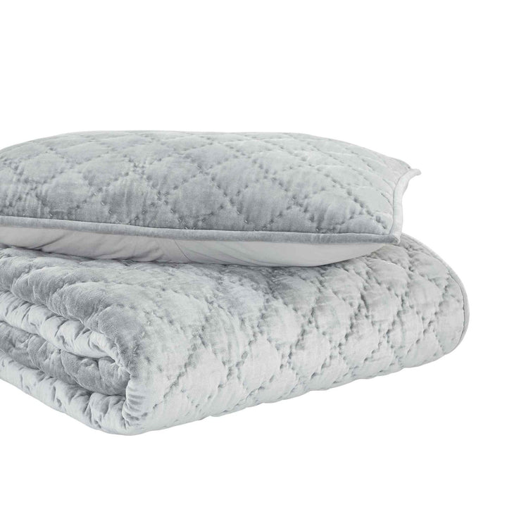 QT-356-11096_5|Light blue-grey velvet quilt with delicate diamond quilting, folded neatly with matching pillow on a white background.