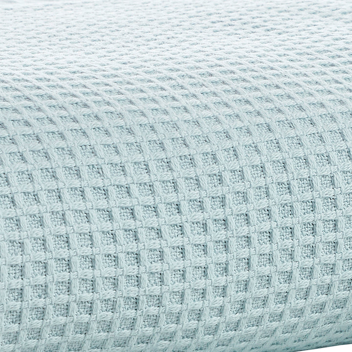 SWT-857-7.8_1|Refreshing light blue waffle weave fabric, showcasing its distinct textured squares for a breathable, comfortable textile.
