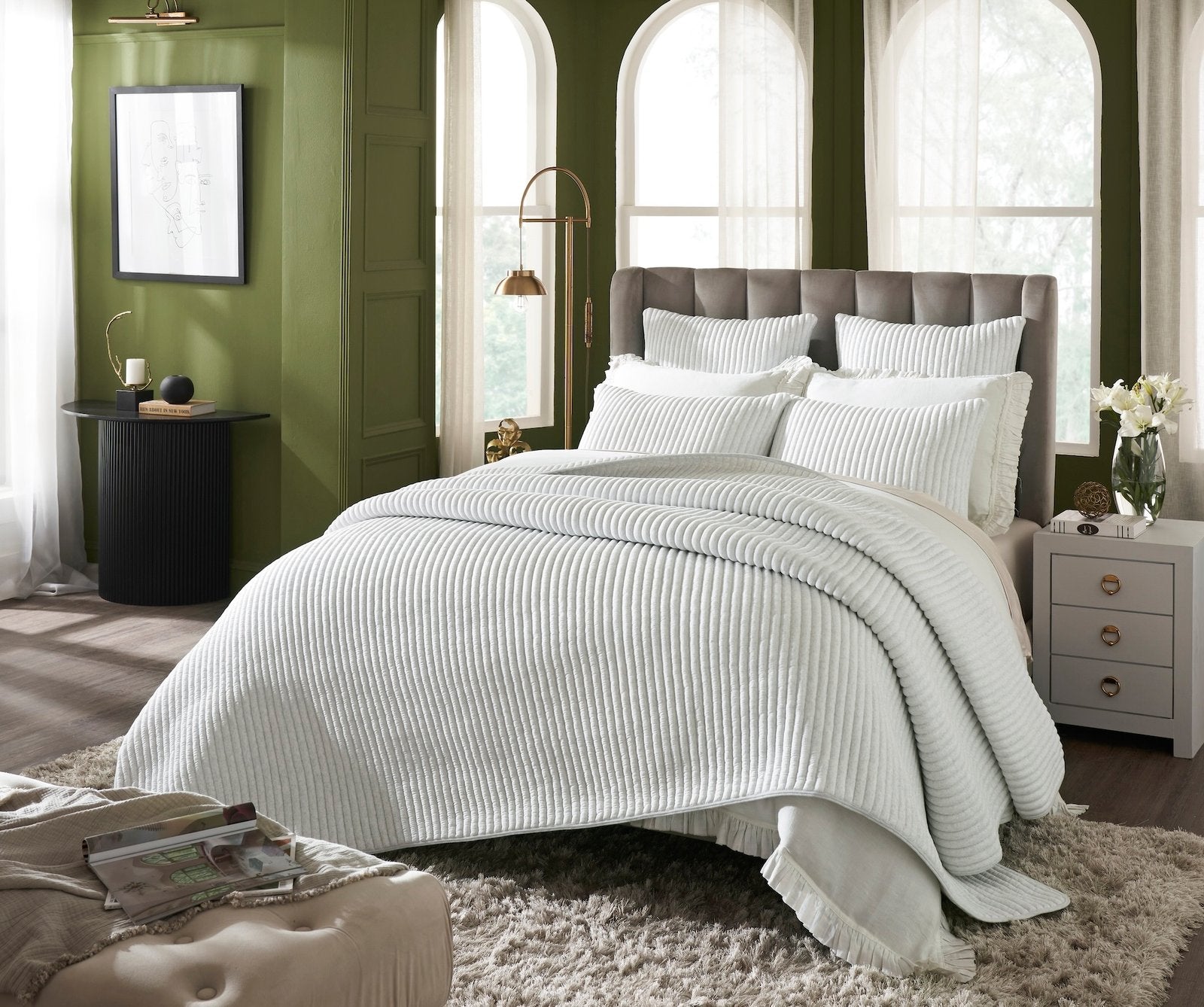 QT-367-X_1|Luxurious white velvet lumbar pillow with vertical channel quilting, adding elegant texture to a modern bed setting.