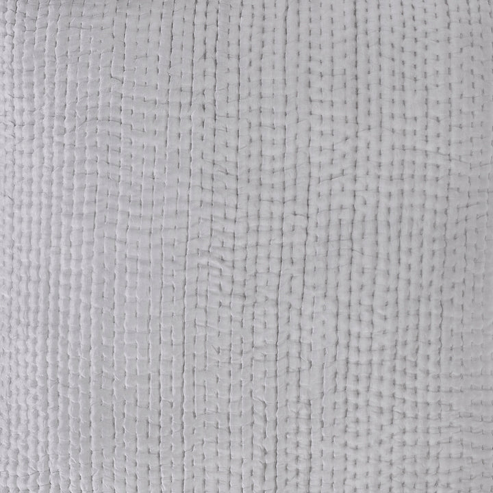 ES-156-2626_3|Close-up of a light grey quilted coverlet fabric. Features a small, dense grid pattern with prominent vertical stitching and soft, woven texture.