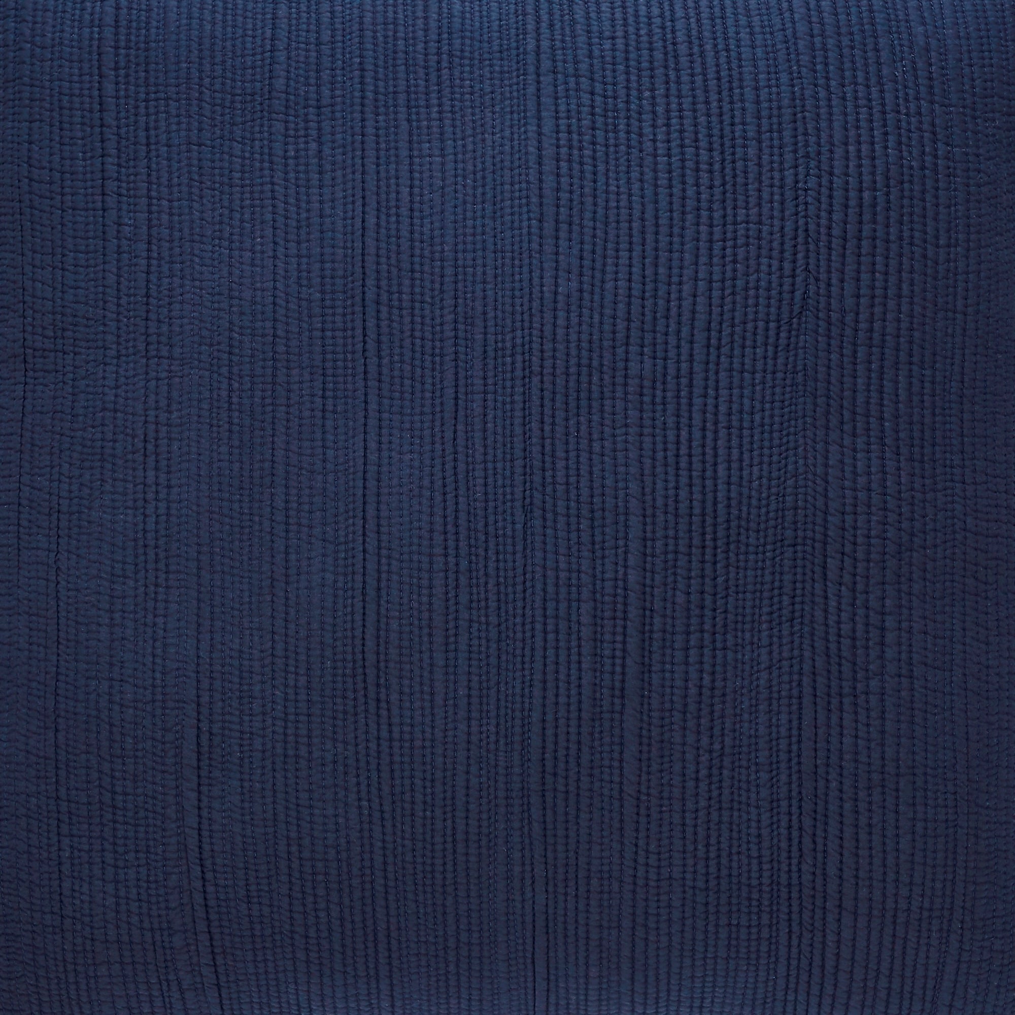 SS-167-2026_3|Close-up of navy blue quilted coverlet fabric, detailed vertical stitched lines providing elegant texture.