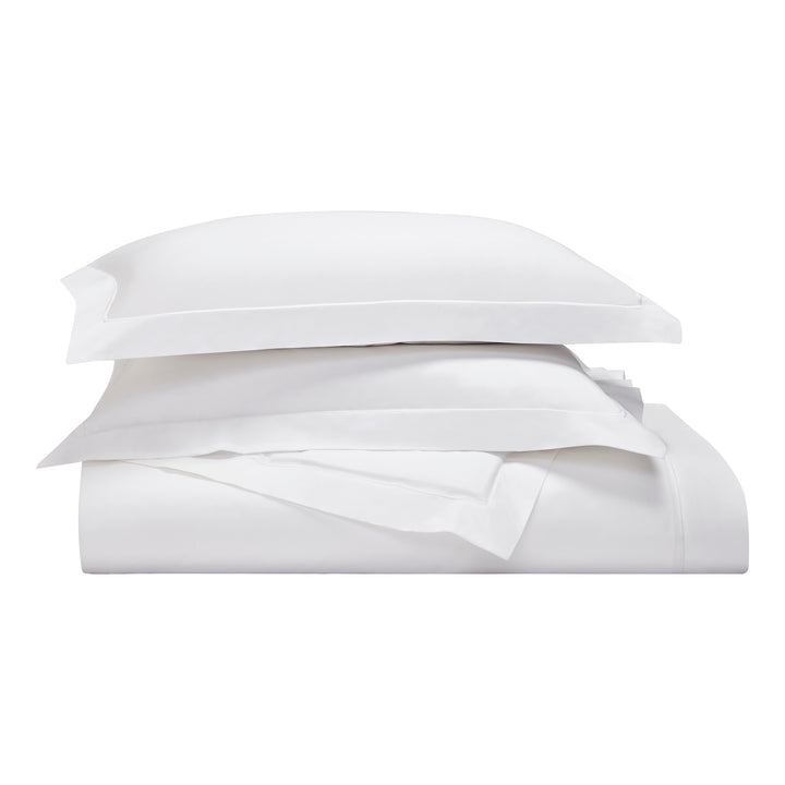 DT-058-6886_4|Stacked crisp white luxury duvet cover, neatly folded for classic hotel style premium bedding. Pure soft comfort.