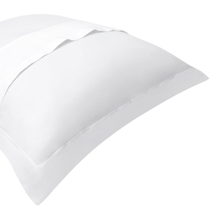 SS-056-2026_2|Close-up of clean white cotton sateen pillowcase with a refined hemstitch finish, enhancing classic bedroom duvet covers.