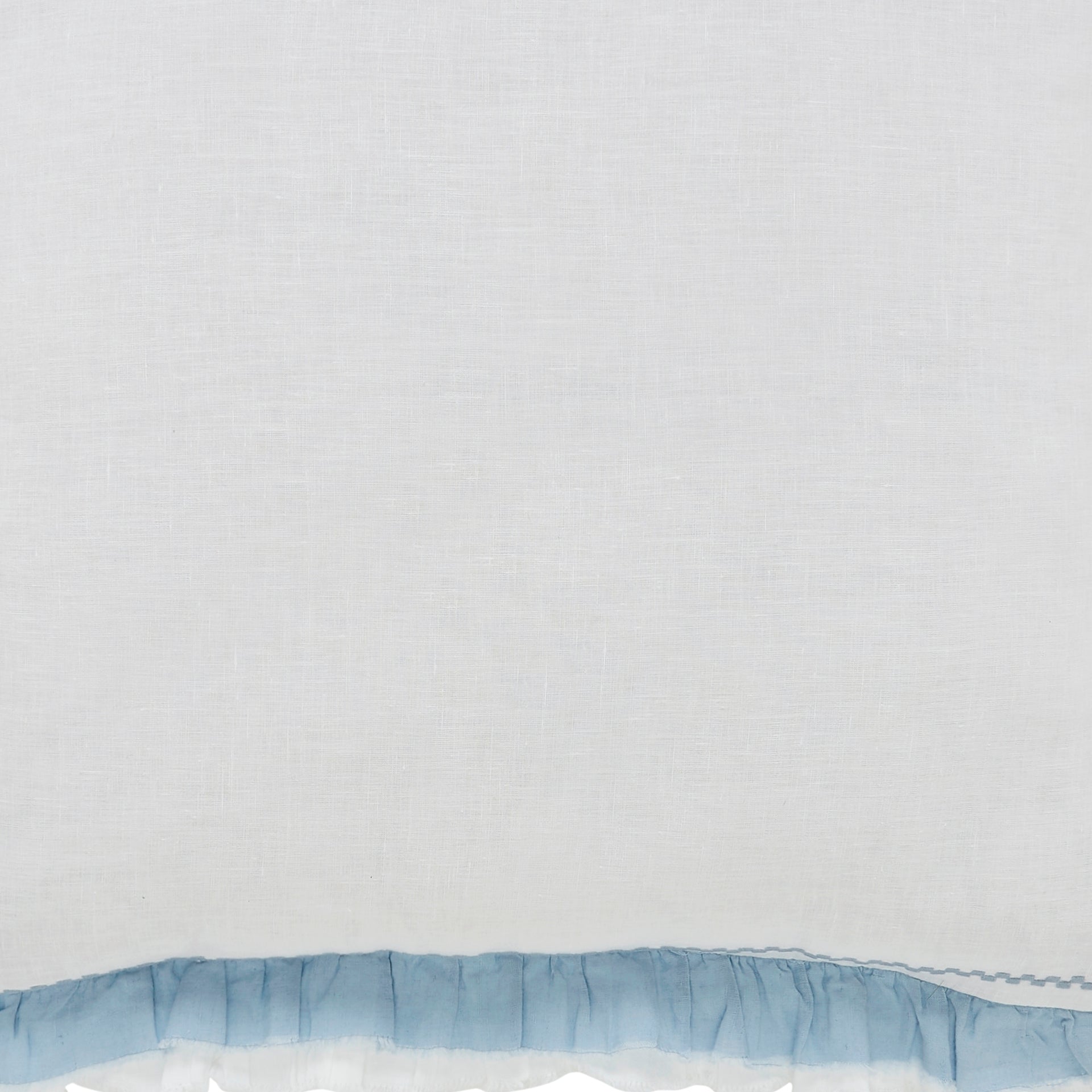 SWT-028-7.8_1|Pure white fabric complemented by a charming light blue ruffled border detail. Soft and elegant for bedding or curtains.