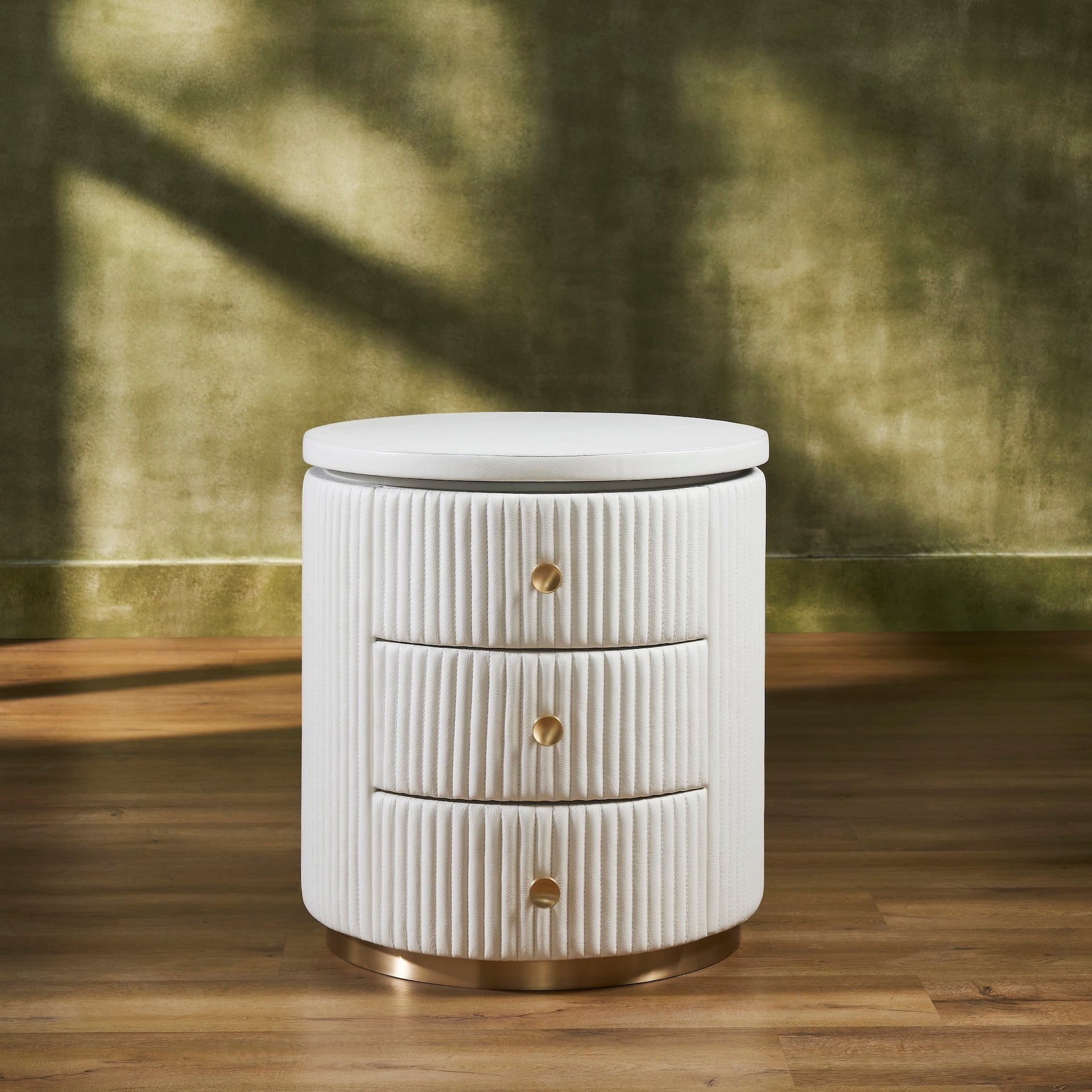 FN-5212-202022_1|Elegant white round nightstand featuring a unique fluted texture, three spacious drawers, and luxurious gold knob accents.