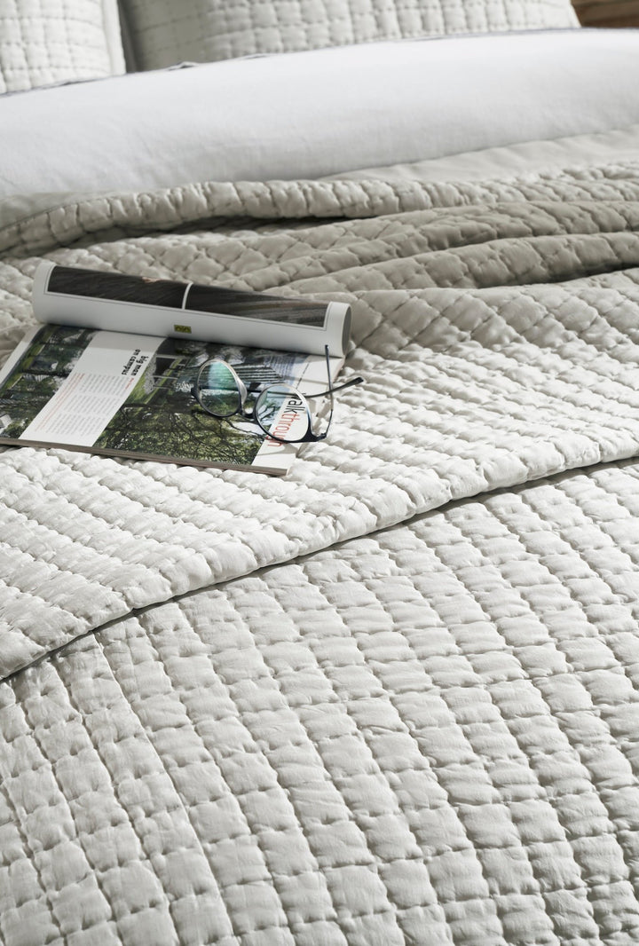 CL-198-11096_4|Close-up of a light grey coverlet showcasing its intricate grid-stitched texture, perfect for modern and cozy bedroom styling.