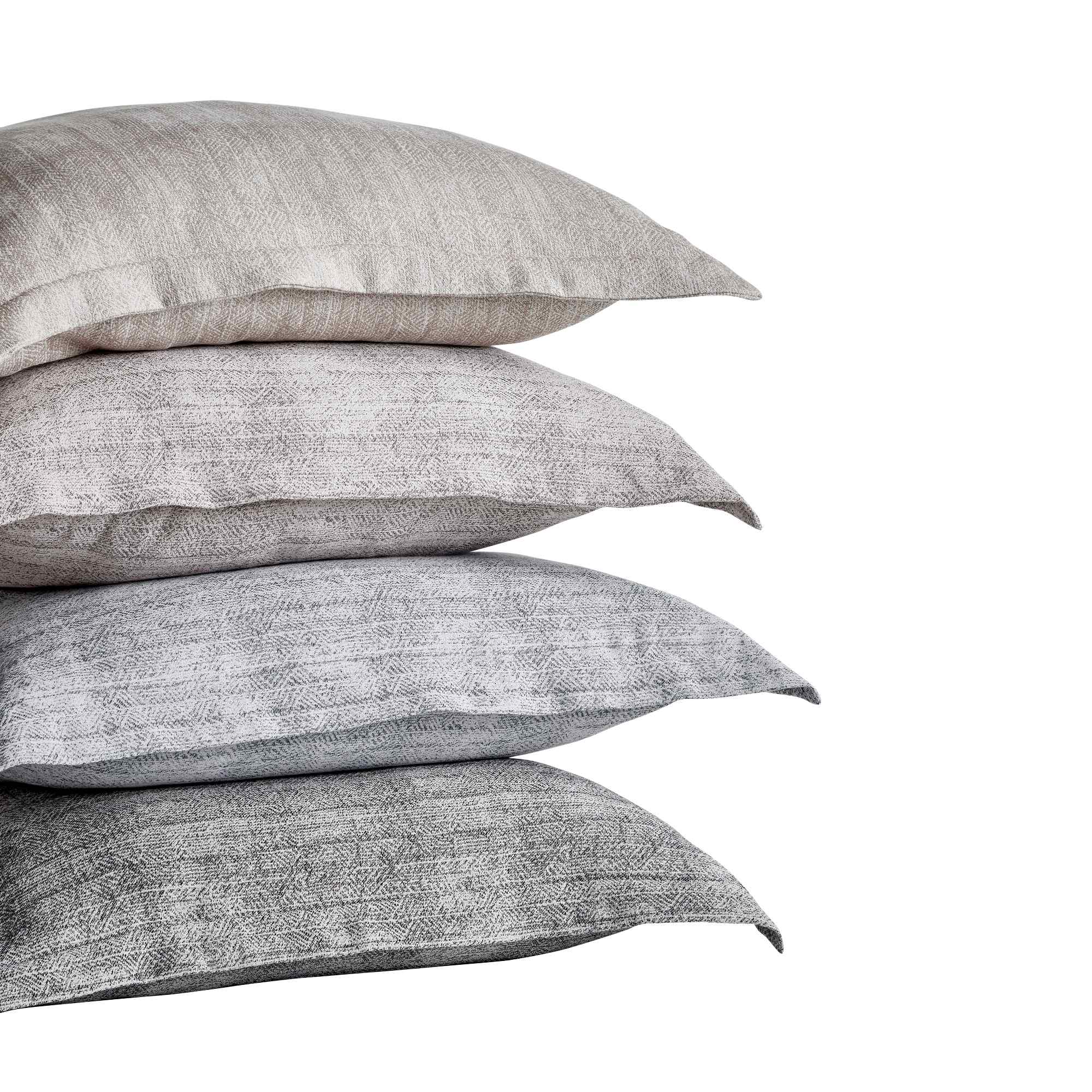 ES-034-2626_2|Stacked textured light beige and gray duvet covers with subtle geometric patterns, perfect for modern bedroom decor.