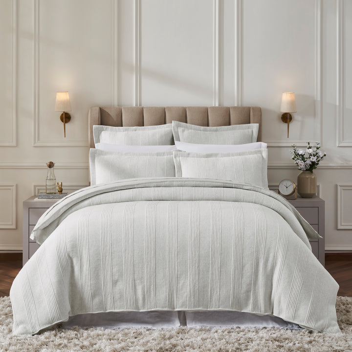 DT-043-9092_1|Elegant light grey ribbed duvet cover set on a bed, with matching shams and pillows for a luxurious bedroom aesthetic.