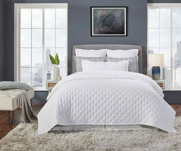 QT-349-X_1|Luxurious white diamond quilted bedding set, featuring quilt, shams, and pillows, creating a serene bedroom retreat.