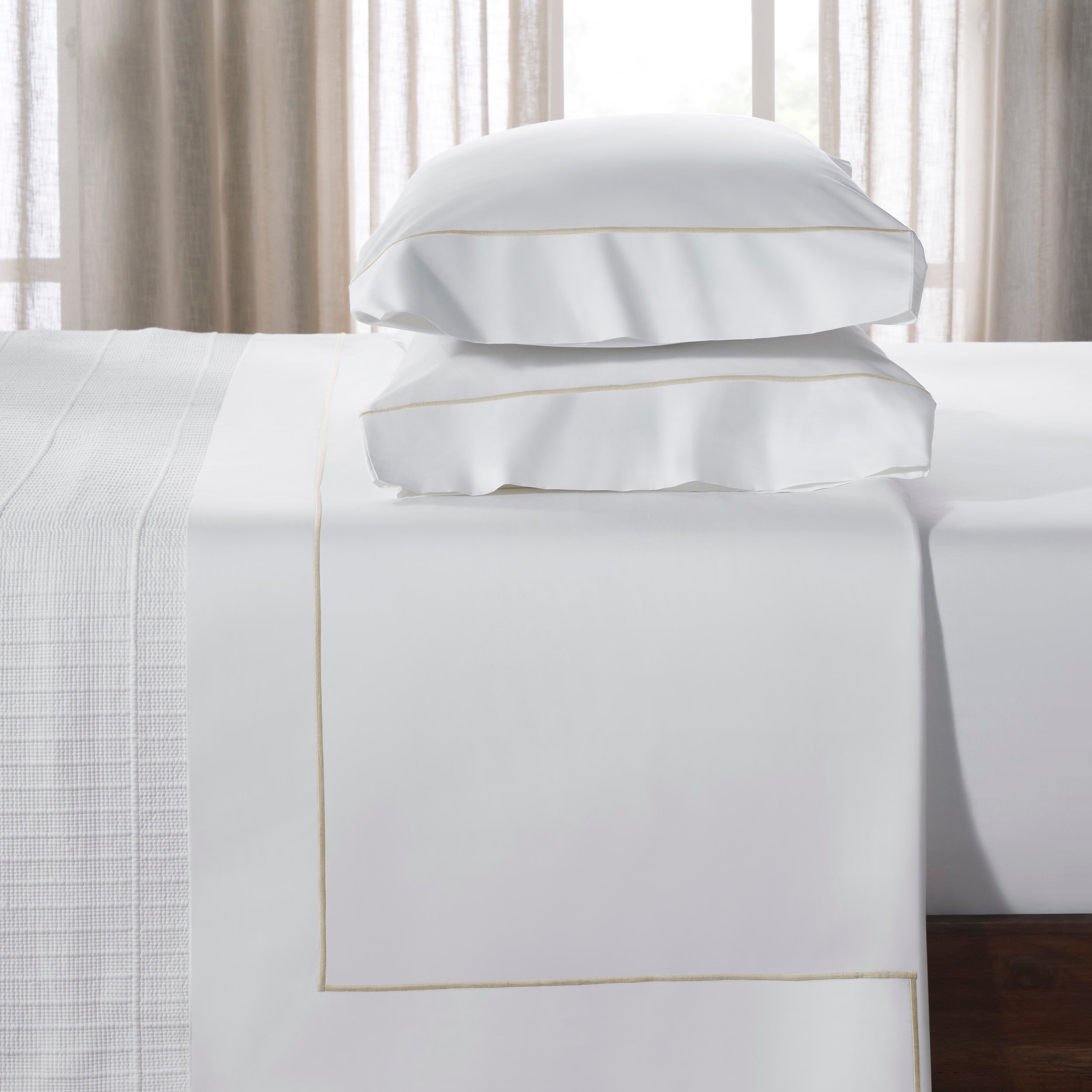 QFL-531-6080_3|Premium 100% cotton white sheets & stacked pillowcases with elegant tan border, offering luxurious, comfortable bedroom bedding.