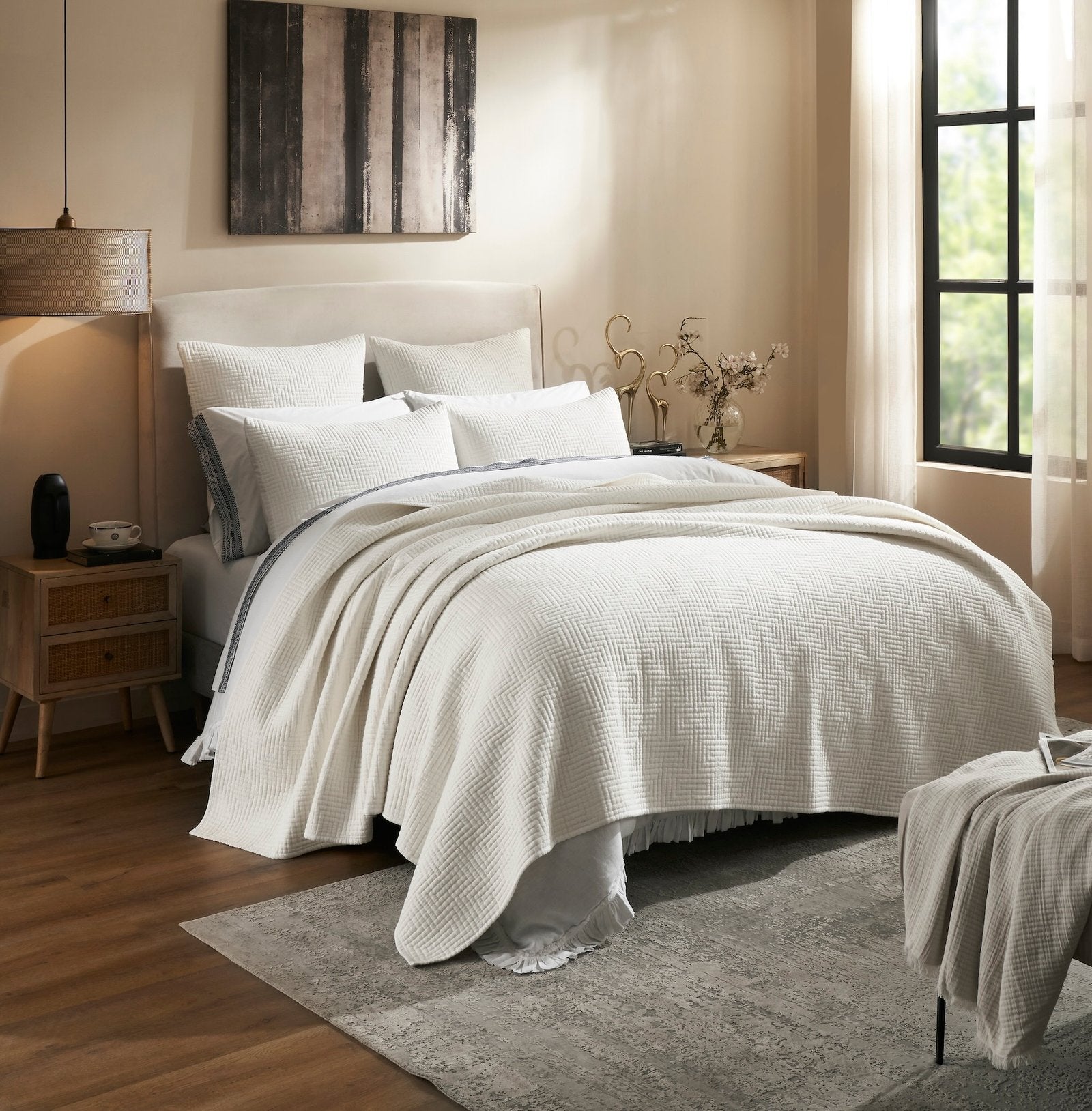 CL-199-11096_2|White textured coverlet with a subtle herringbone pattern on a bed in a light-filled bedroom. Stylish and inviting.