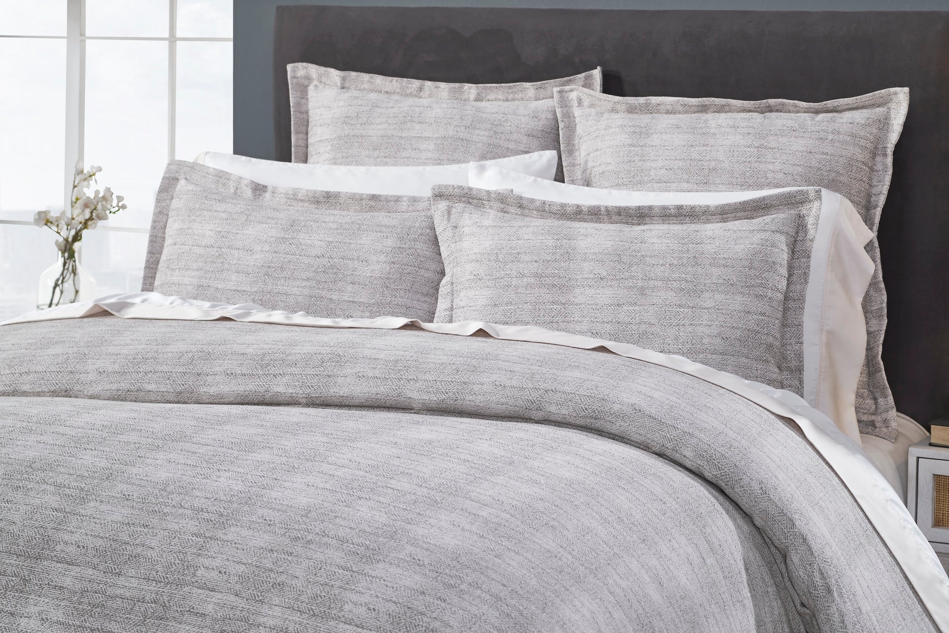 DT-032-X_2|Detailed close-up of a stylish grey textured duvet cover and matching shams, perfect for modern bedrooms.
