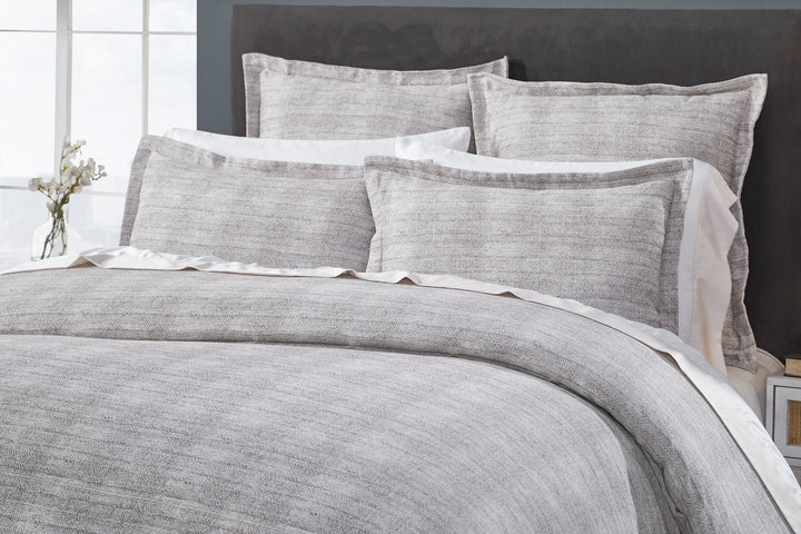 DT-032-X_2|Detailed close-up of a stylish grey textured duvet cover and matching shams, perfect for modern bedrooms.