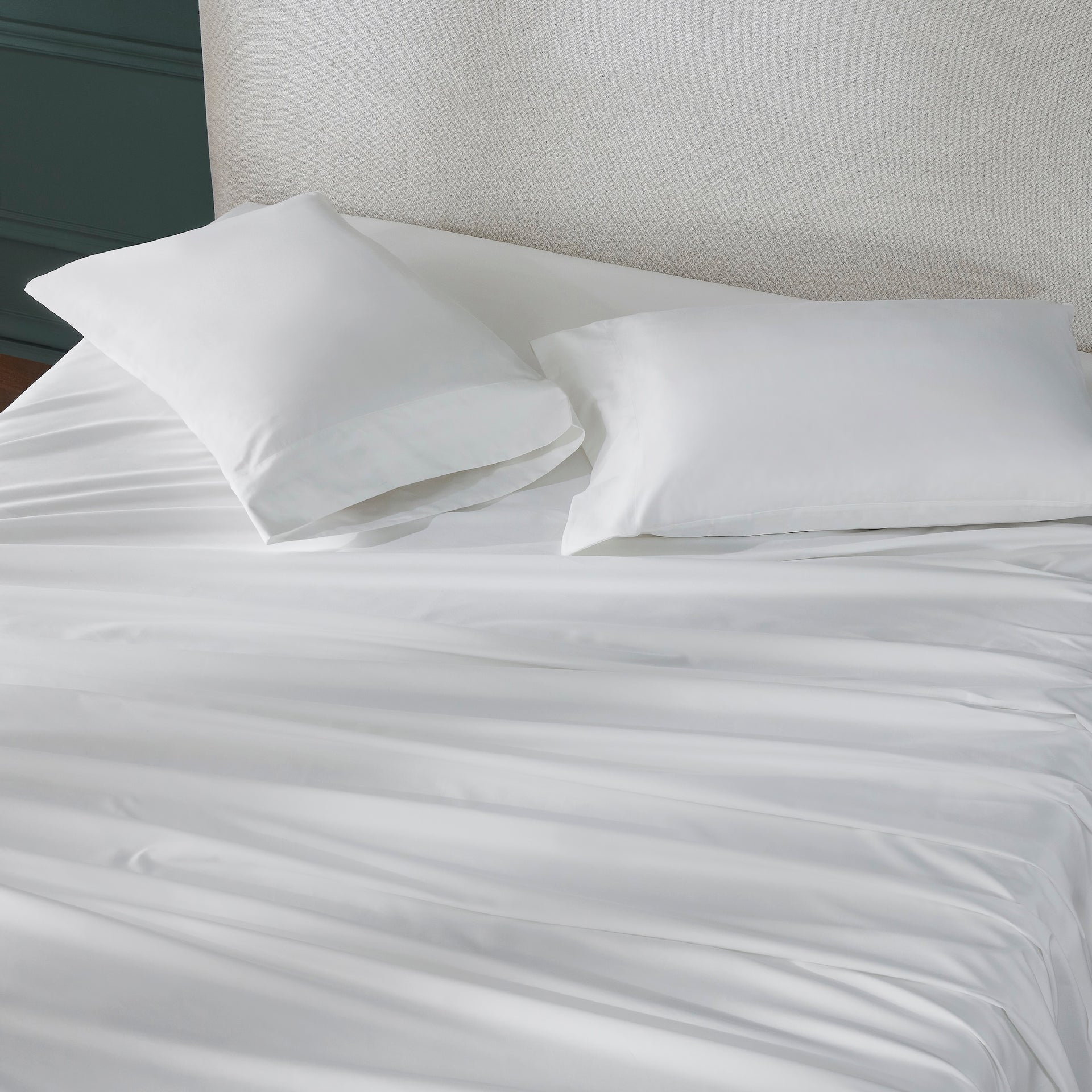 ASP-547-X_2|White 100% cotton sateen sheet set on a bed, featuring a flat sheet and two hemmed pillowcases, smooth finish.