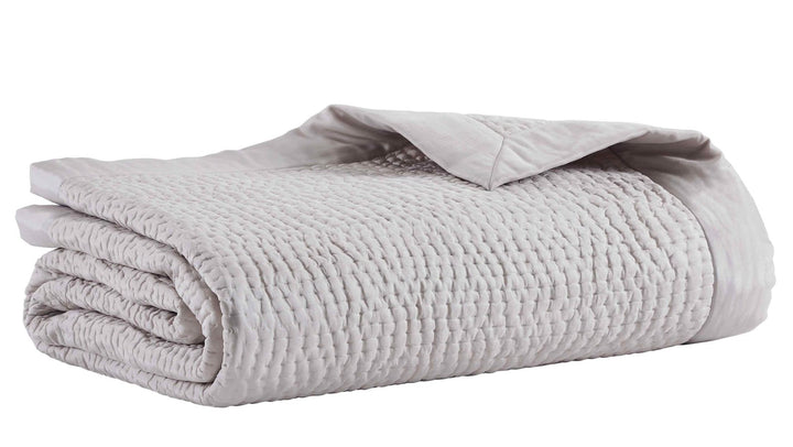 CL-166-11096_5|Folded light grey quilted coverlet featuring a small, irregular waffle-like quilting pattern and clean finish.