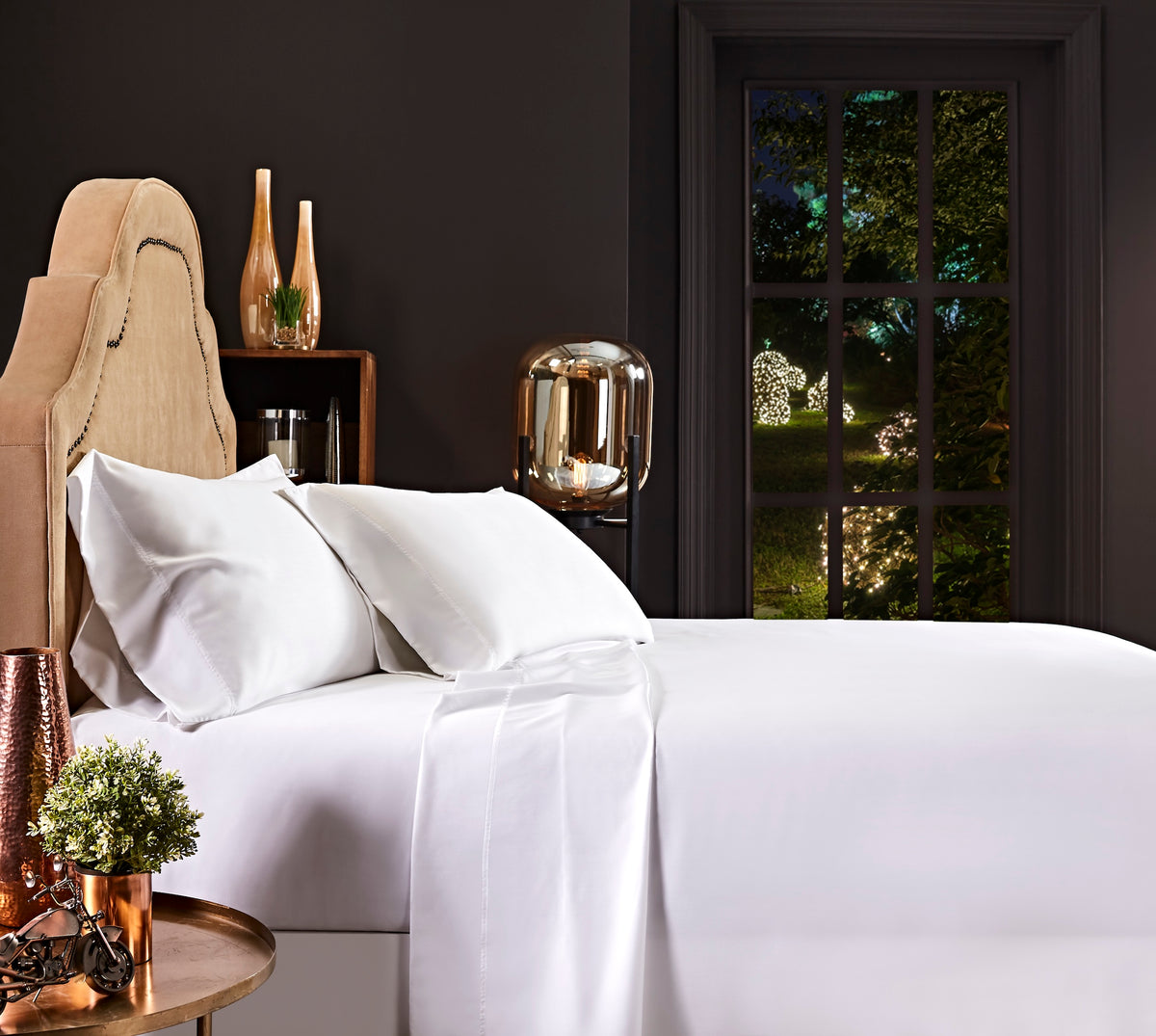 KFL-509-7880_1|White 100% Lyocell sheet set on a bed, including a fitted sheet, a neatly folded flat sheet, and two pillowcases.