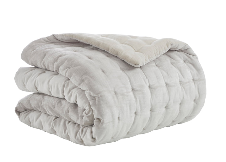 QT-306-9496_4|Reversible light grey and beige tufted quilt, folded, showcasing square quilting. Versatile, cozy bedding for a comfortable bedroom.