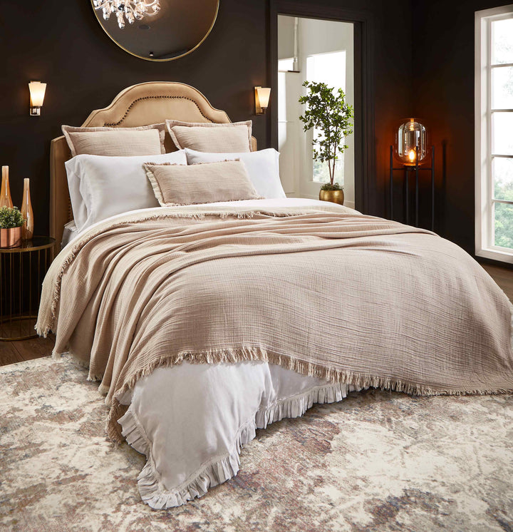 BT-112-9496_1|Elegant, textured light brown blanket with fringe detail covers a luxurious bed, enhancing bedroom comfort and style.