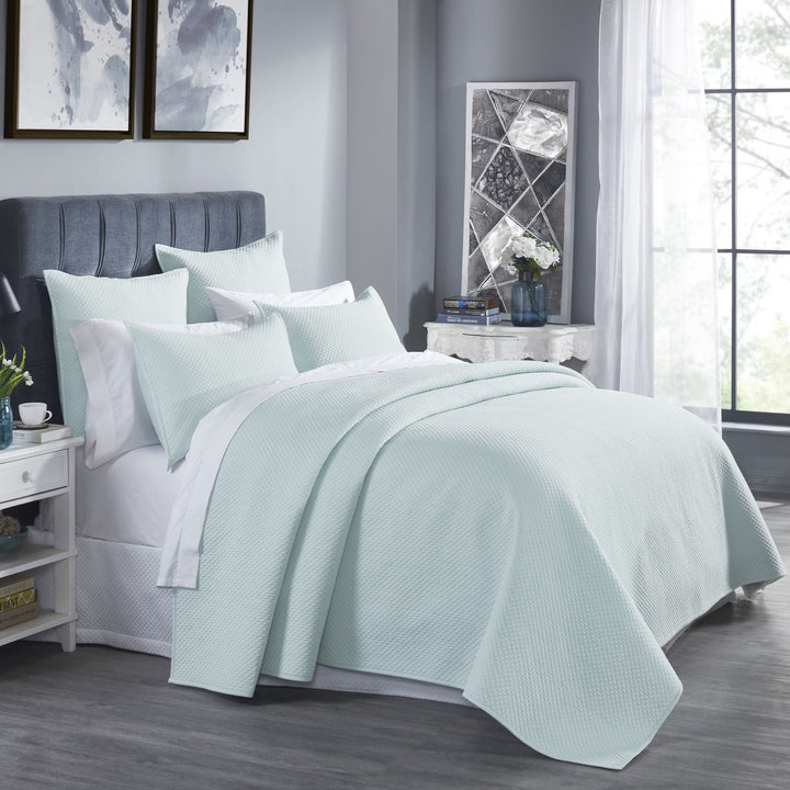 CL-252-9496_2|Refreshing mint green quilted coverlet adorning a stylish bed, offering cozy comfort and elegant modern bedroom appeal.