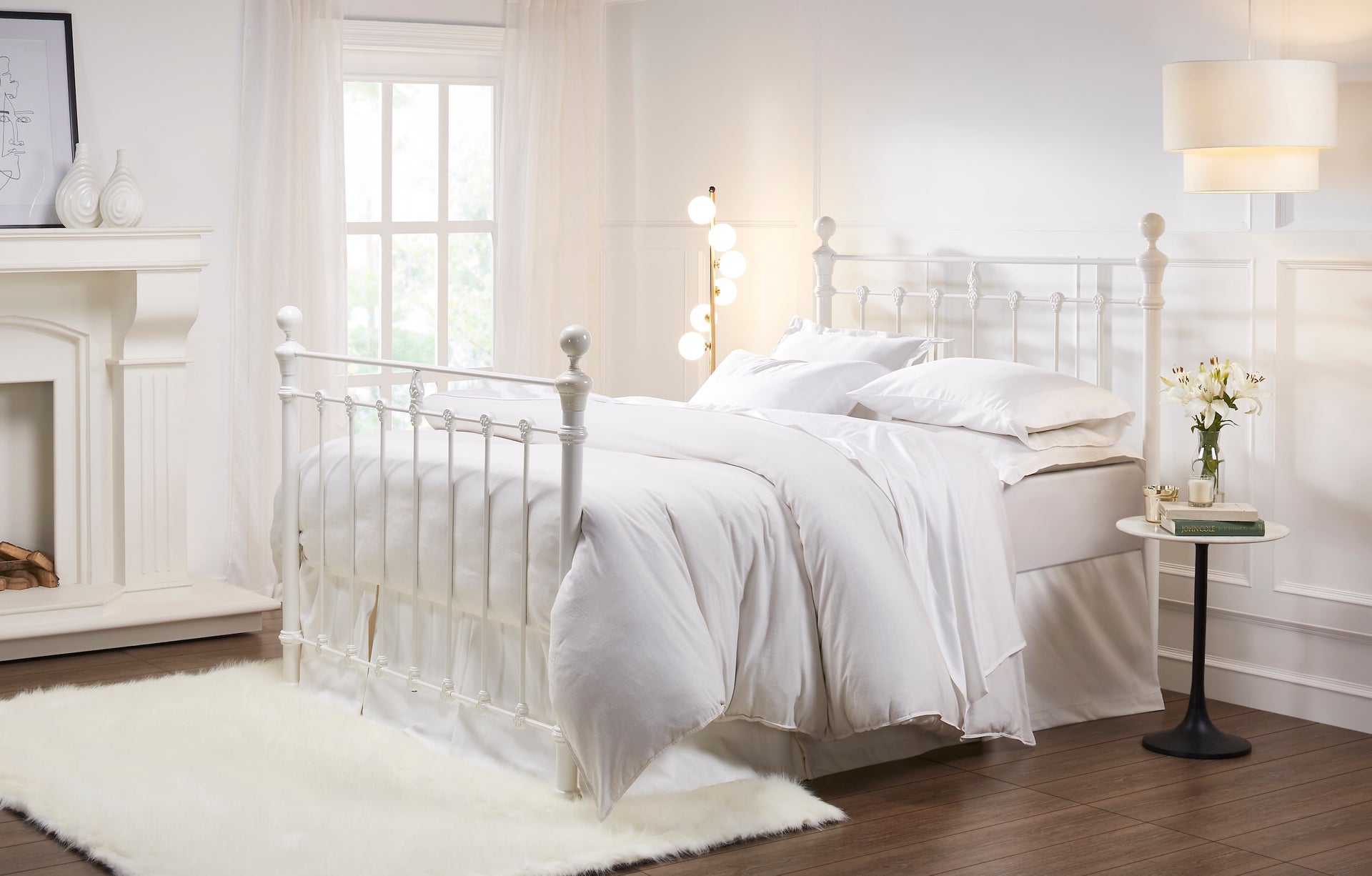 MB-202-X-1_1|Classic white metal bed frame with intricate scrollwork, providing a timeless and elegant centerpiece for a cozy bedroom.