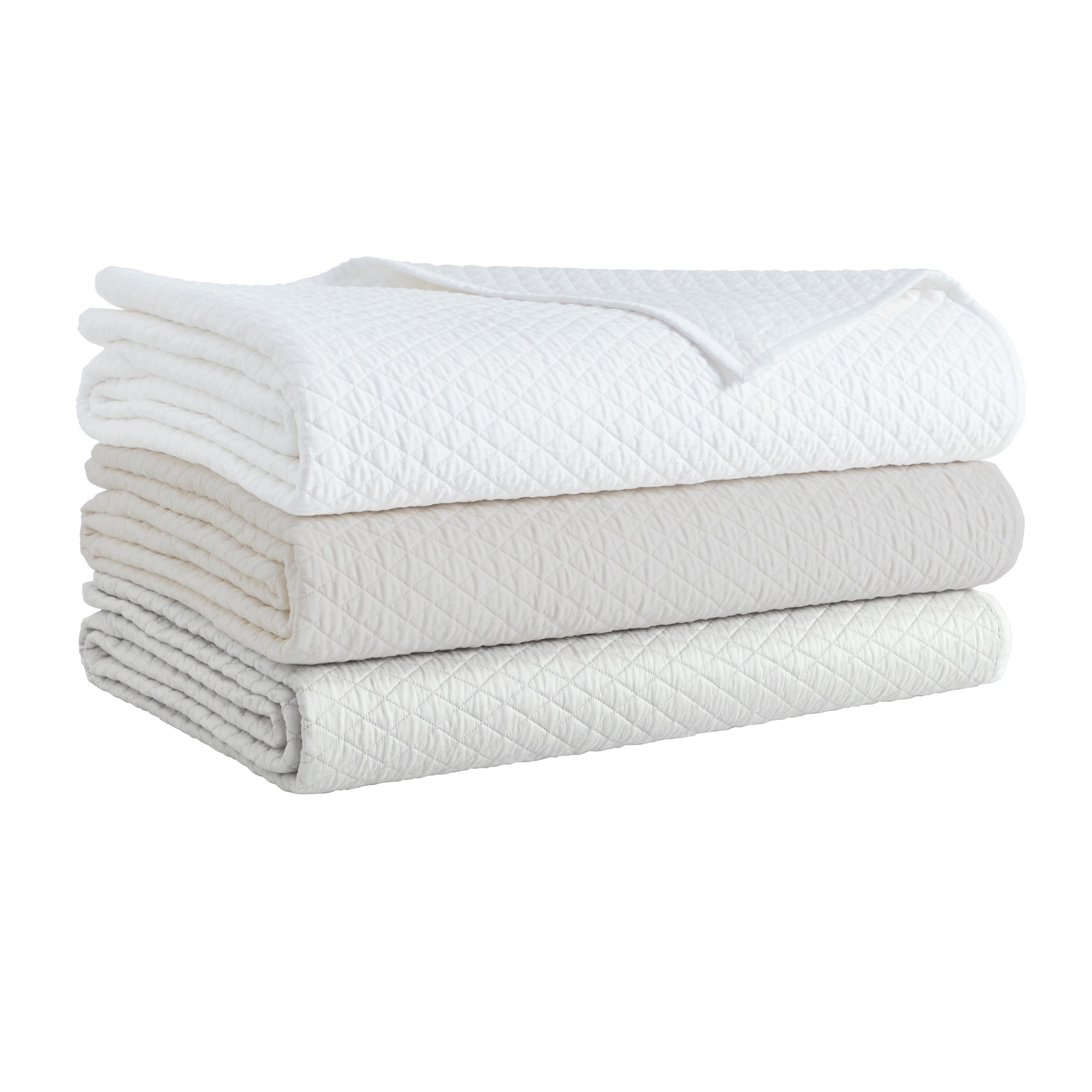 CL-265-9496_8|Stack of three diamond quilted coverlets: crisp white, soft ivory, and light gray. Luxurious bedding for a serene bedroom.