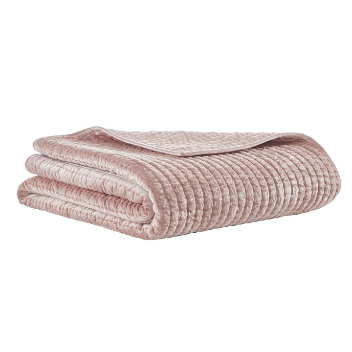 QT-354-9496_1|Soft dusty pink velvet quilt, elegantly folded. Plush channel-quilted texture, adds warmth and luxury to bedding.