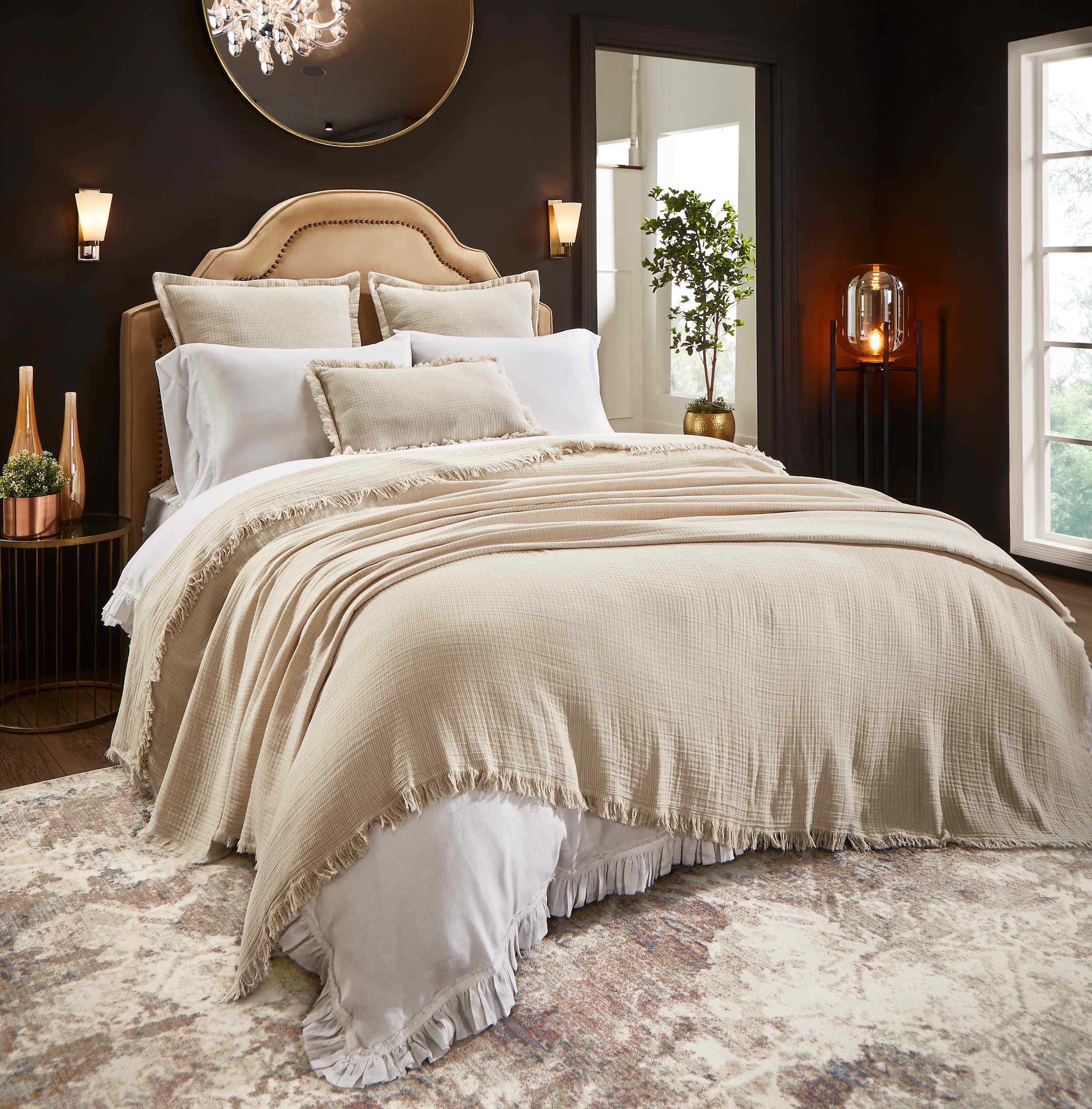 BT-114-9496_1|Luxurious beige textured blanket with a stylish fringe edge draped over a bed, adding warmth and elegance to modern bedroom decor.