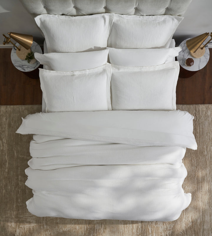 DT-048-9092_5|Luxurious white crinkled muslin cotton duvet cover on a neatly made bed, offering a cozy and elegant bedding solution.