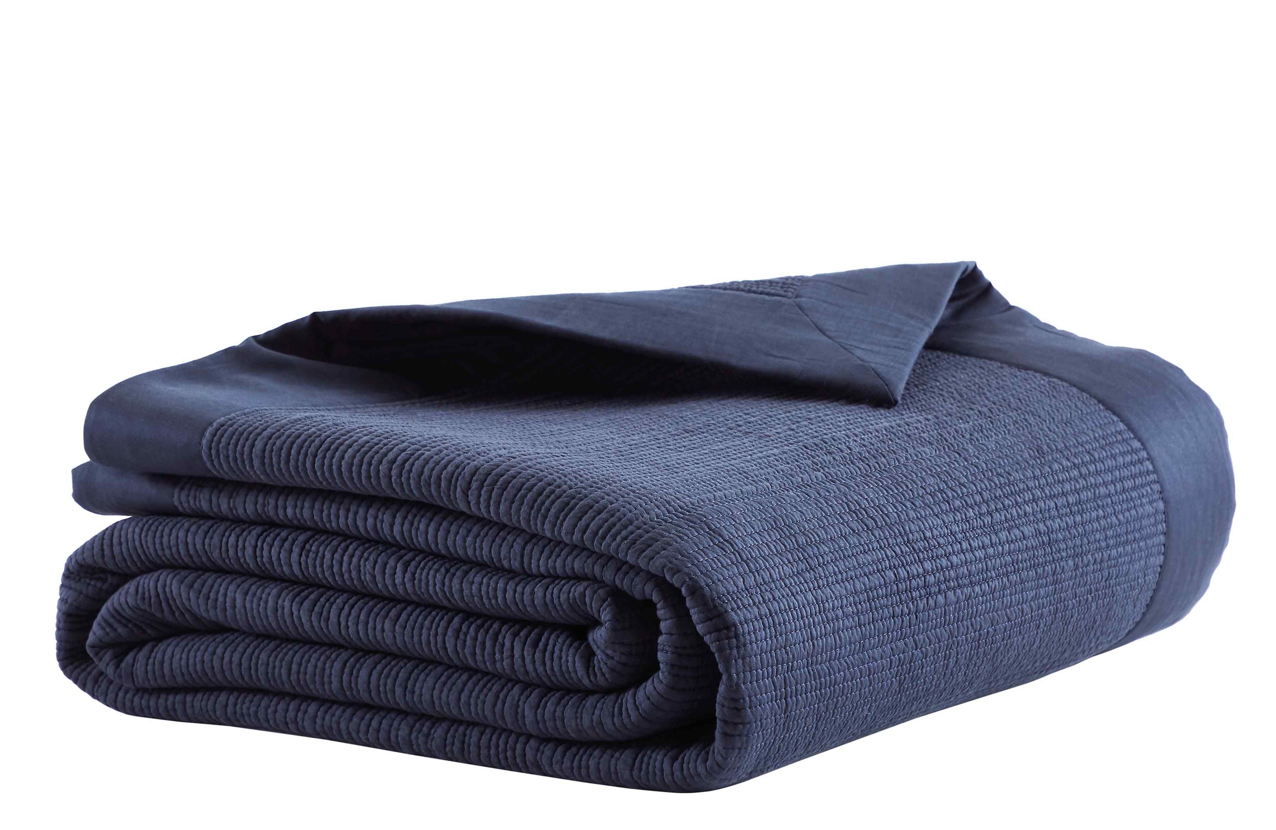 CL-167-11096_4|Neatly folded navy blue coverlet, highlighting its rich ribbed texture. A versatile and cozy addition to any modern bed.