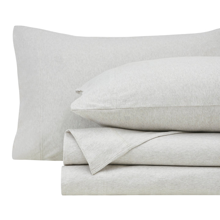 KSS-526-7880_5|Folded soft, cozy light beige 100% cotton jersey sheets and pillowcases, offering breathable, relaxed, and easy-care comfort.
