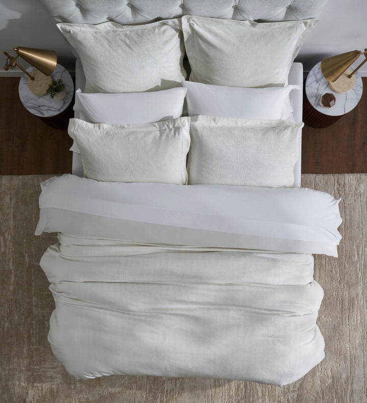 DT-052-10692_4|Soft off-white textured duvet cover and matching pillows for luxurious comfort. Overhead view of a cozy, inviting bedroom setup.