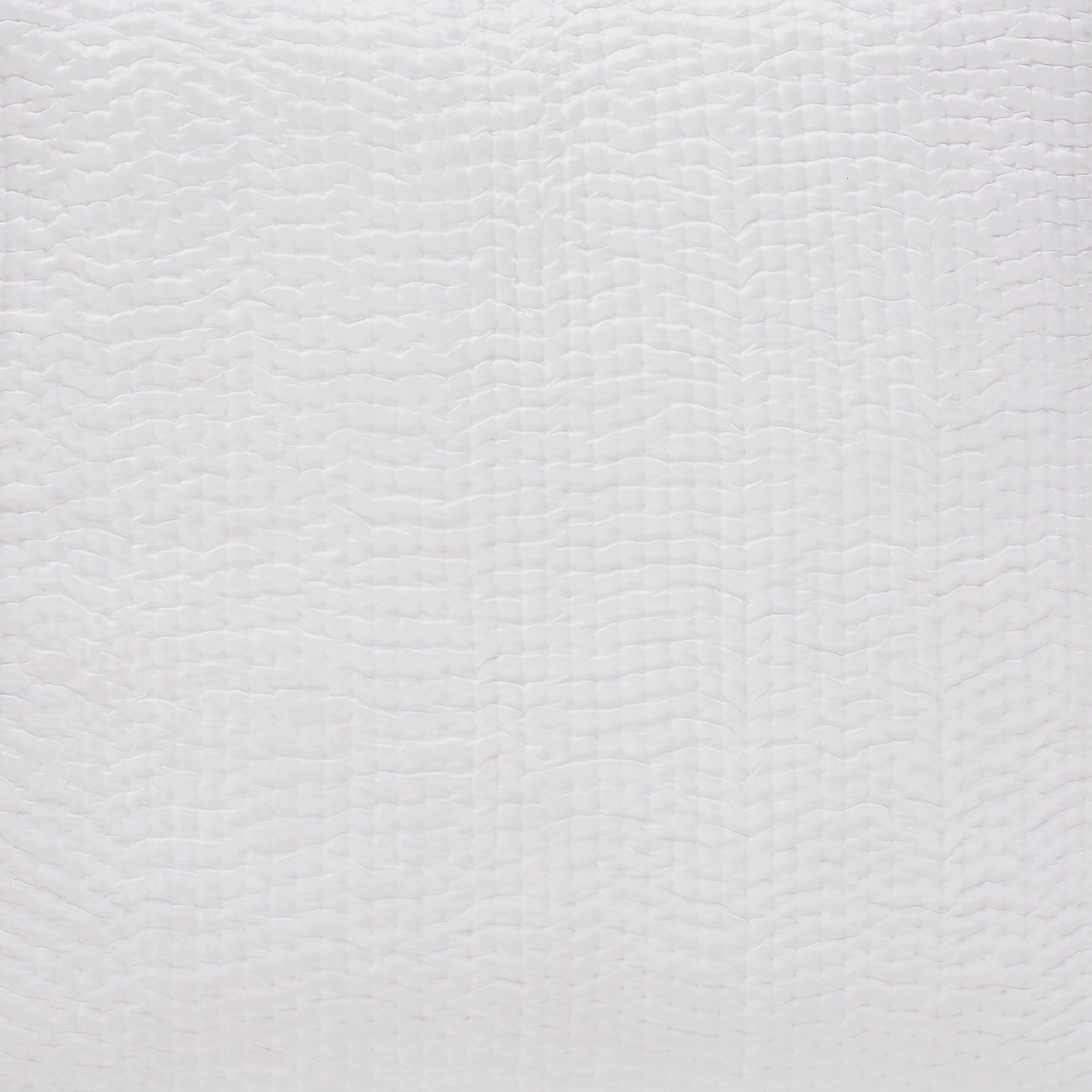CL-165-9496_2|Close-up texture of a pristine white quilted coverlet, featuring an elegant, subtle wave pattern for bedding.