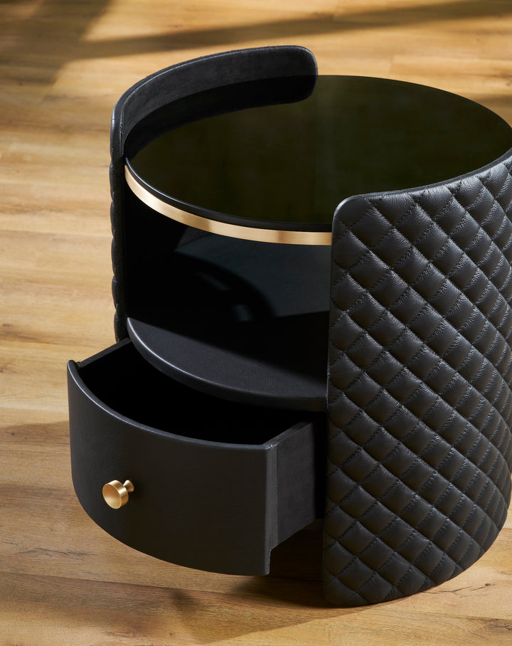 FN-5215-202022_4|Detailed view of black quilted leather nightstand with gold hardware and open drawer, revealing luxury bedroom storage.