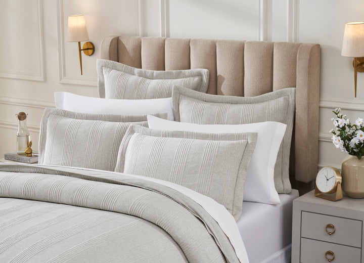DT-044-9092_3|Close-up of elegant light grey ribbed duvet cover with matching textured shams, enhancing a modern, comfortable bedroom.