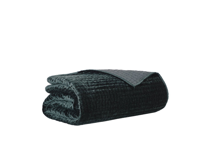 QT-363-11096_7|Neatly rolled dark green quilted blanket with reversible design, offering rich velvet texture and versatile styling options.