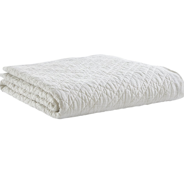 CL-254-9496_6|Soft beige linen-blend quilted coverlet, neatly folded. Ideal neutral bedding for added bedroom comfort and style.