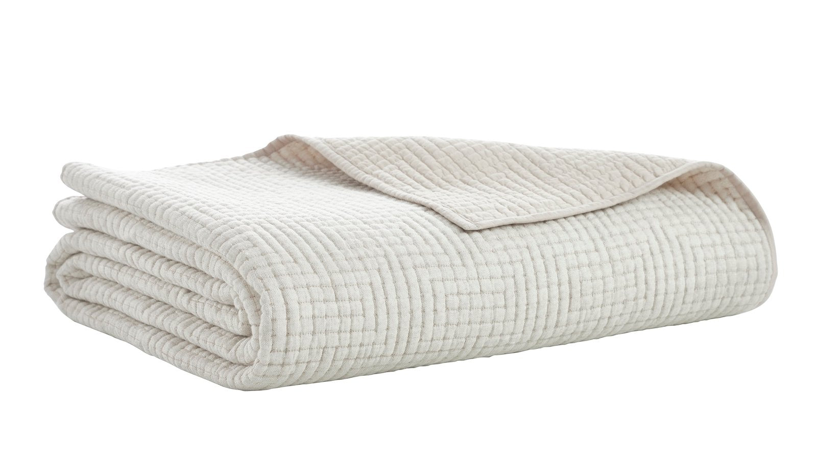 CL-259-9496_7|Creamy white textured waffle weave coverlet folded neatly, showcasing its soft, inviting fabric and simple elegance.
